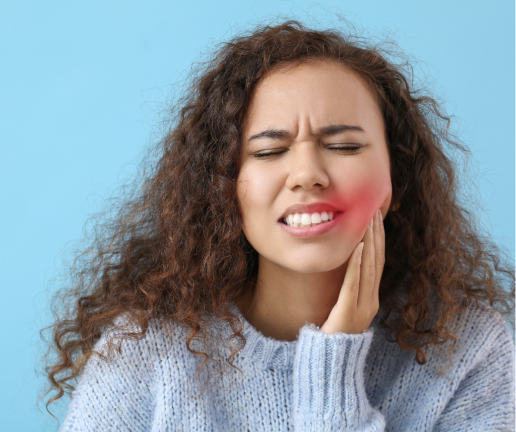 Woman with tooth pain caused by cold weather